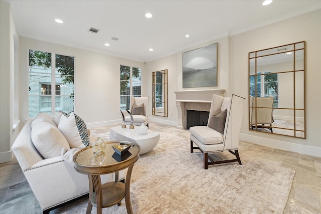 living area featuring recessed lighting, a fireplace, visible vents, and baseboards