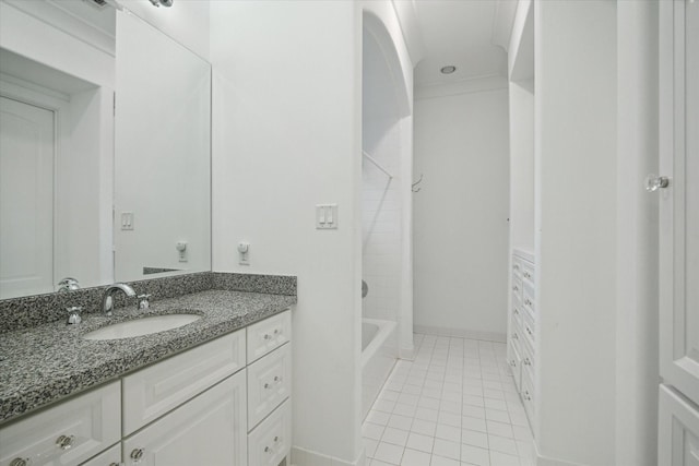 full bath with tub / shower combination, tile patterned flooring, vanity, and baseboards