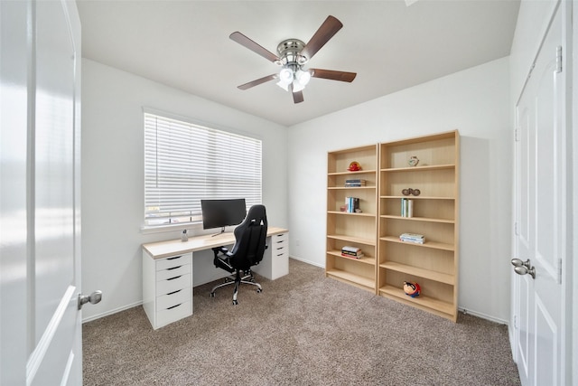 home office with carpet, baseboards, and a ceiling fan