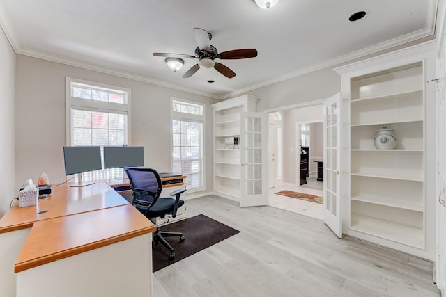 office area featuring light wood finished floors, a ceiling fan, crown molding, and french doors