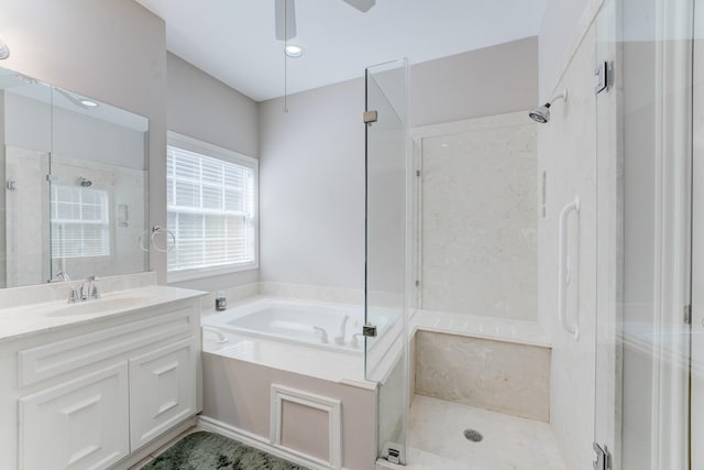 bathroom featuring a shower stall, vanity, and a bath