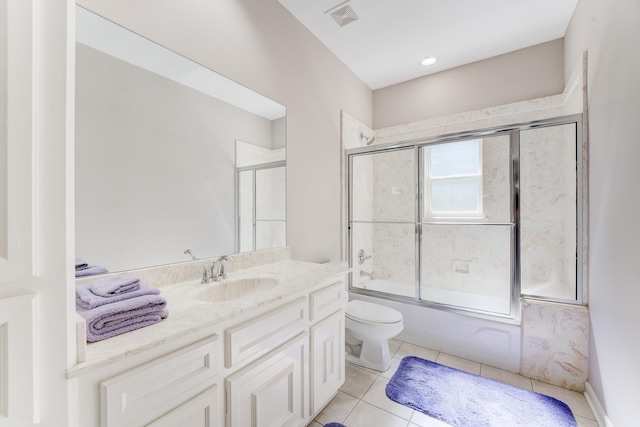 full bathroom featuring visible vents, toilet, enclosed tub / shower combo, tile patterned floors, and vanity