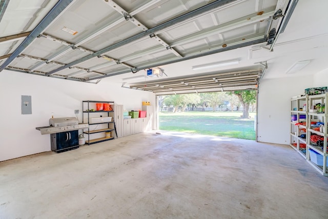 garage with electric panel and a garage door opener