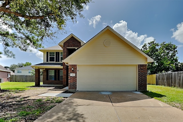 traditional home featuring a garage, brick siding, driveway, and fence