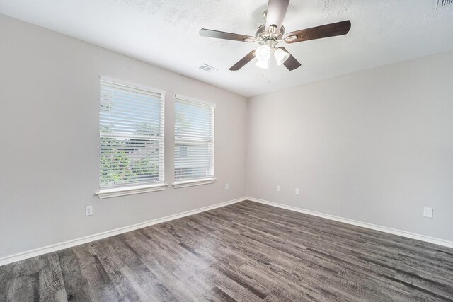1911 Arrow Star Ct, Katy, TX 77493 - empty room with dark wood-style flooring and a ceiling fan