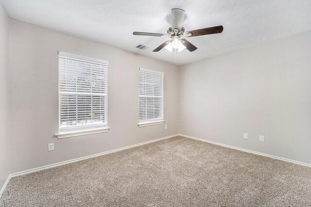 1911 Arrow Star Ct, Katy, TX 77493 - carpeted empty room with a ceiling fan and baseboards