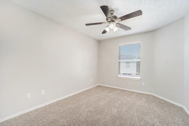1911 Arrow Star Ct, Katy, TX 77493 - unfurnished room with light colored carpet, a ceiling fan, and a textured ceiling