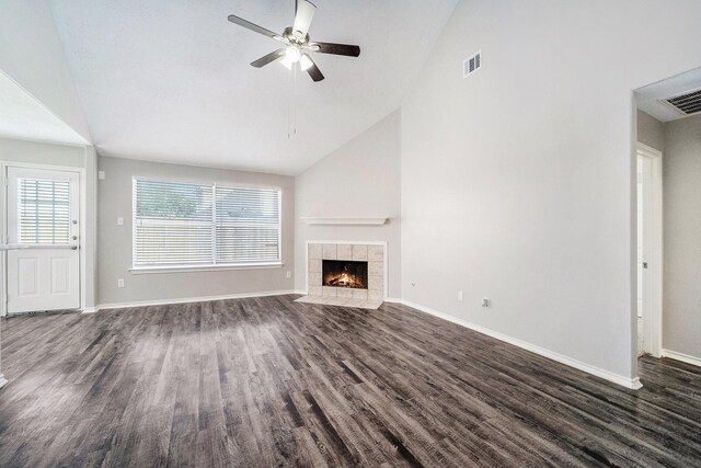 1911 Arrow Star Ct, Katy, TX 77493 - unfurnished living room featuring dark wood-style flooring, a ceiling fan, a fireplace, and high vaulted ceiling