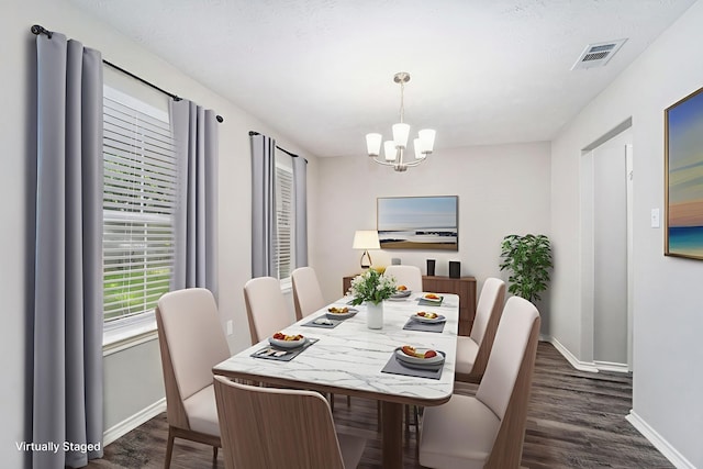 1911 Arrow Star Ct, Katy, TX 77493 - dining area with a chandelier and dark wood-style floors