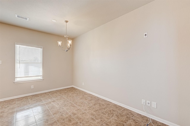 empty room featuring baseboards, visible vents, a chandelier, and light tile patterned flooring