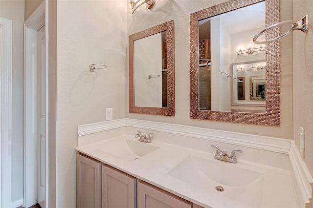 full bath featuring double vanity and a sink