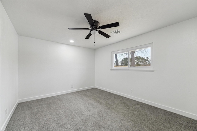 spare room featuring baseboards, visible vents, ceiling fan, carpet flooring, and recessed lighting