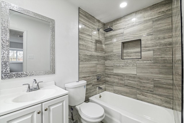 bathroom featuring shower / bathing tub combination, vanity, and toilet