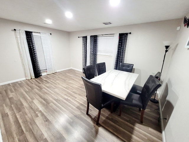 dining room with recessed lighting, visible vents, baseboards, and light wood-style flooring