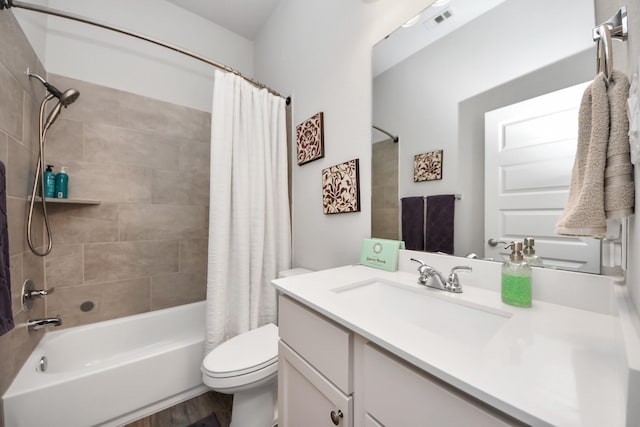 full bathroom with toilet, shower / tub combo, wood finished floors, visible vents, and vanity