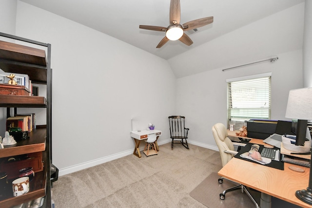 carpeted home office with lofted ceiling, a ceiling fan, and baseboards