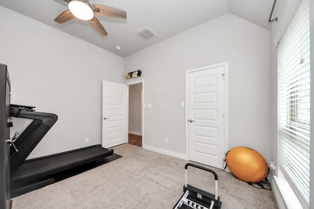 exercise room with baseboards, visible vents, a ceiling fan, lofted ceiling, and carpet