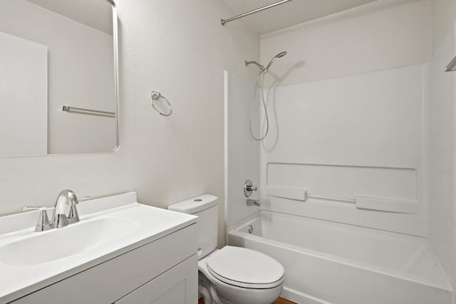 bathroom with shower / bath combination, vanity, and toilet