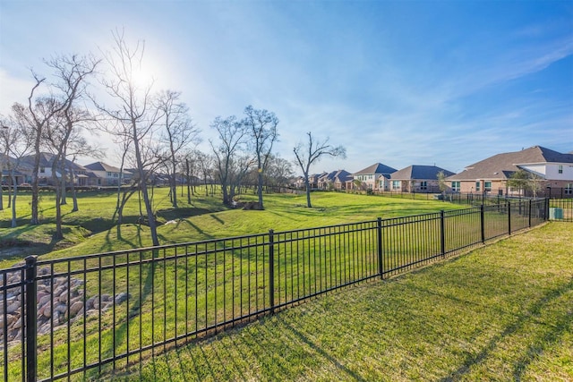 view of yard with a residential view and fence