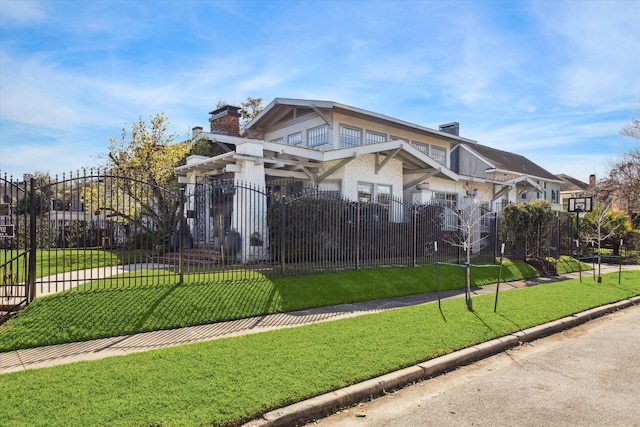 view of home's community featuring a fenced front yard and a yard