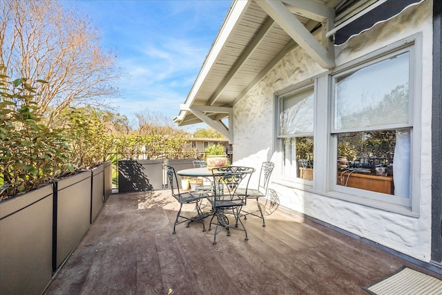 balcony featuring outdoor dining space