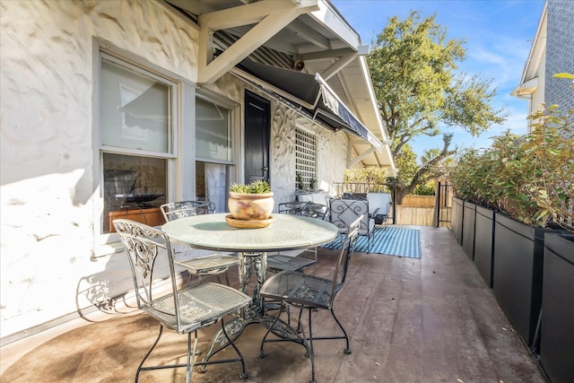 view of patio / terrace featuring fence and outdoor dining area