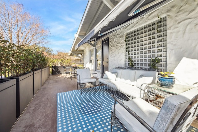 balcony with outdoor lounge area, a patio, and outdoor dining space