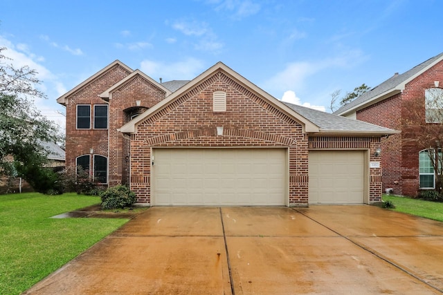 traditional-style house with a garage, brick siding, a front lawn, and a shingled roof