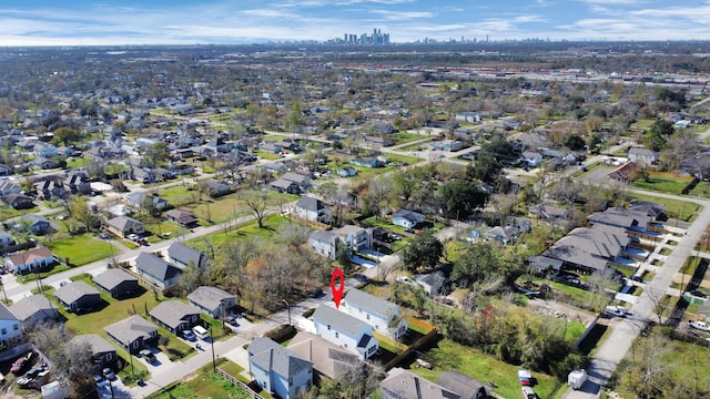 birds eye view of property with a residential view