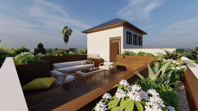 balcony with an outdoor living space with a fire pit