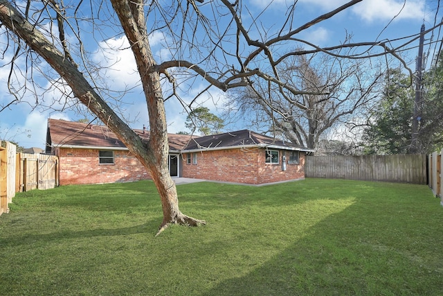 view of yard with a fenced backyard