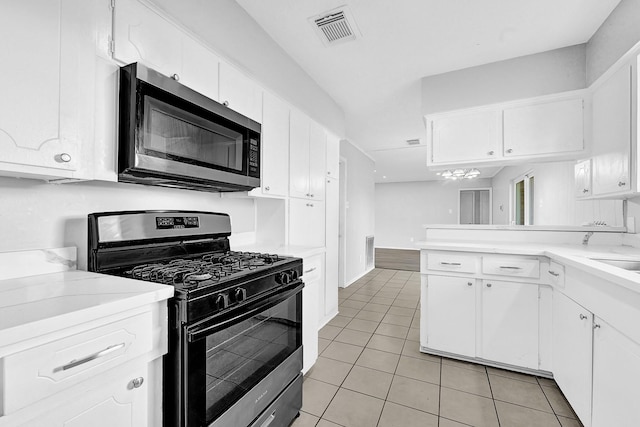 kitchen with white cabinets, visible vents, appliances with stainless steel finishes, and light countertops