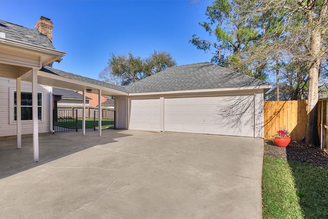 detached garage with fence