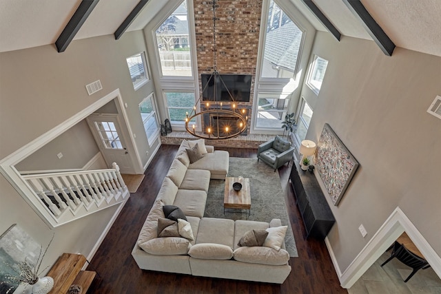 living room with visible vents, high vaulted ceiling, beam ceiling, and baseboards