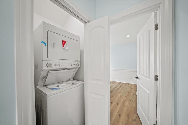4411 Ranger Dr, Crystal Beach, TX 77650 - clothes washing area featuring stacked washer / drying machine, light wood-style flooring, and recessed lighting