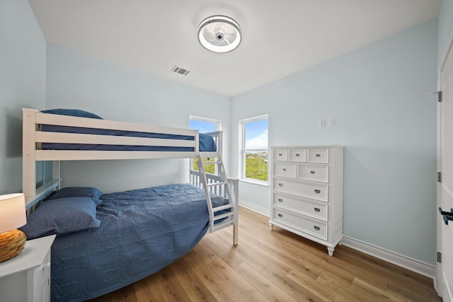 4411 Ranger Dr, Crystal Beach, TX 77650 - bedroom featuring baseboards and wood finished floors