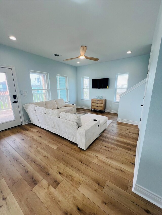 4411 Ranger Dr, Crystal Beach, TX 77650 - living room featuring light wood-type flooring, plenty of natural light, a ceiling fan, recessed lighting, and baseboards