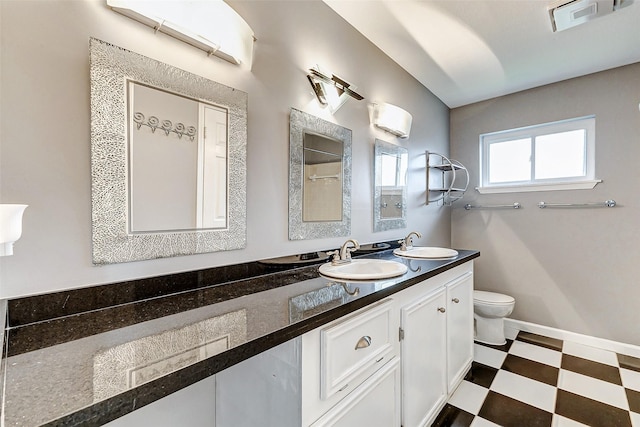 bathroom with visible vents, a sink, toilet, and tile patterned floors