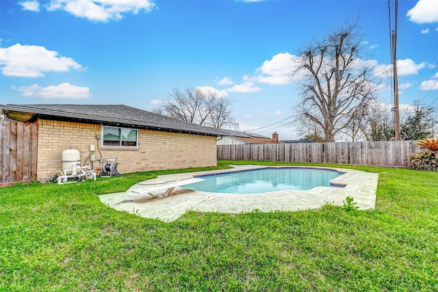 view of pool with a fenced backyard, a fenced in pool, a diving board, and a lawn