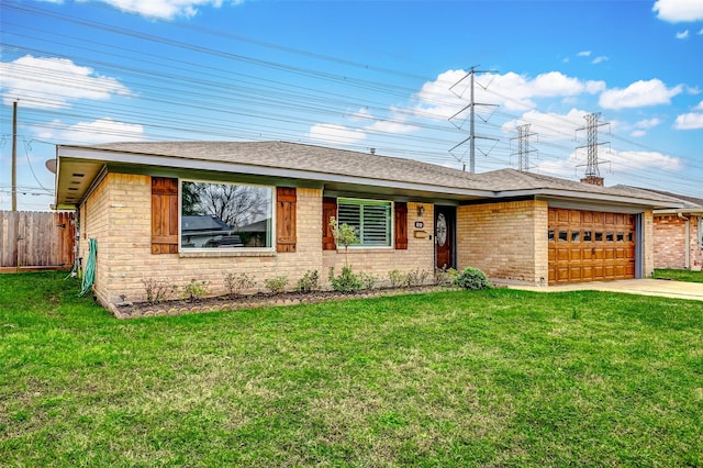 ranch-style house featuring an attached garage, fence, a front lawn, and brick siding