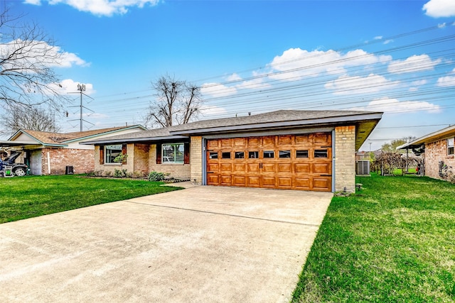 view of front facade featuring driveway, brick siding, a garage, and a front yard