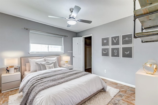 bedroom featuring baseboards and a ceiling fan