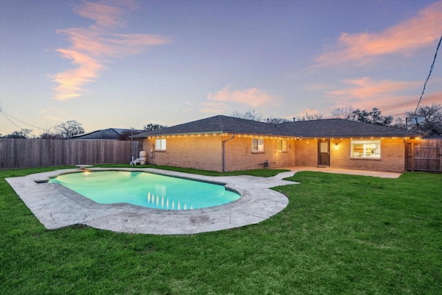 view of pool featuring a fenced backyard, a fenced in pool, a patio, and a yard