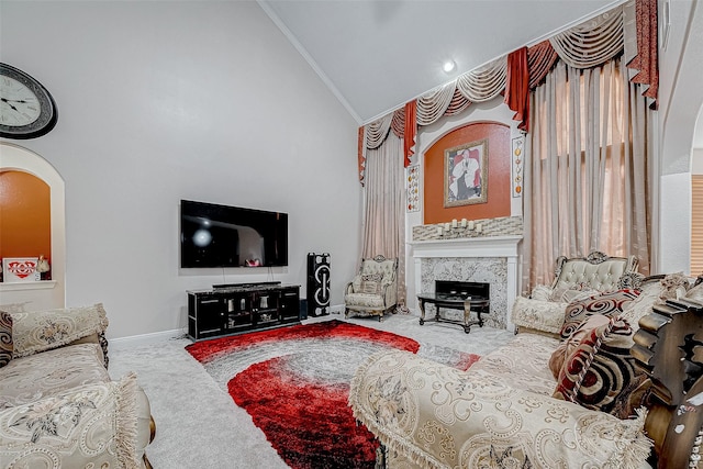 carpeted living room with baseboards, arched walkways, ornamental molding, high vaulted ceiling, and a high end fireplace