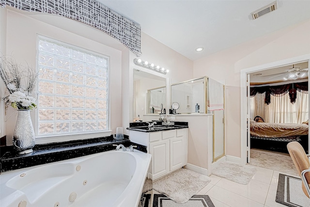 full bathroom with visible vents, connected bathroom, a shower stall, vanity, and tile patterned floors