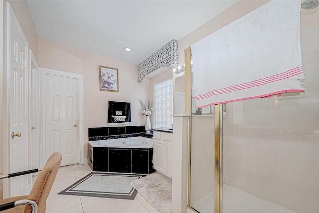 full bath with a shower stall, a bath, and tile patterned floors