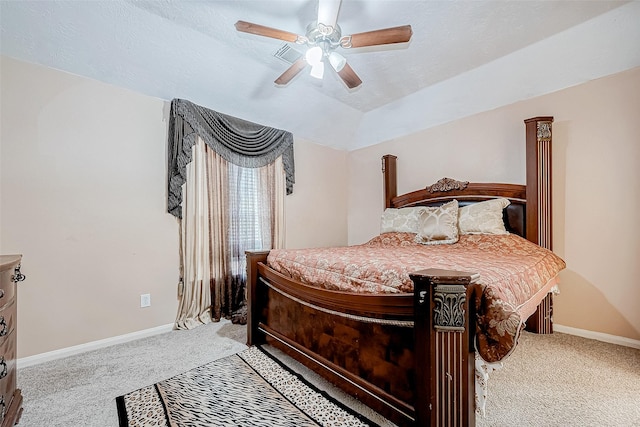 bedroom featuring light colored carpet, vaulted ceiling, a textured ceiling, ceiling fan, and baseboards