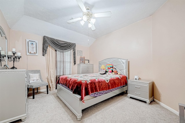 bedroom with vaulted ceiling, a textured ceiling, baseboards, and light colored carpet