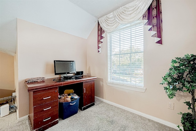 home office featuring light carpet, lofted ceiling, and baseboards