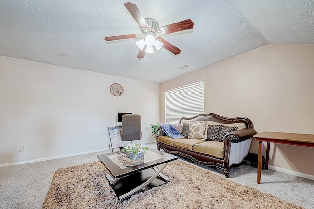 carpeted living area featuring lofted ceiling, visible vents, a ceiling fan, a textured ceiling, and baseboards